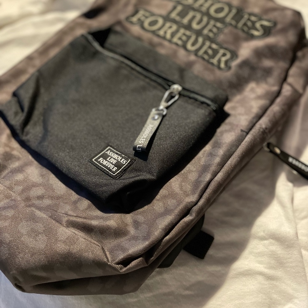 Linda finegold Assholes Live Forever leopard backpack